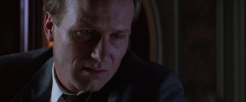 Movie still from “The Accidental Tourist” (1988), directed by Lawrence Kasdan – A person wearing a suit and tie; Close Up shot, Low angle