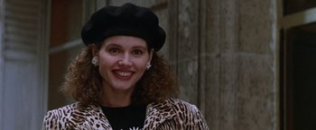 Movie still from “The Accidental Tourist” (1988), directed by Lawrence Kasdan – A woman wearing a black hat and a leopard print coat; Close Up shot, Low angle