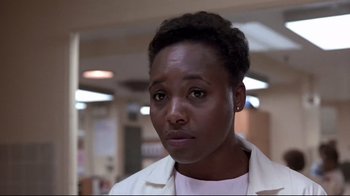 Movie still from “The Accused” (1988), directed by Jonathan Kaplan – A person wearing a lab coat; Close Up shot, Low angle