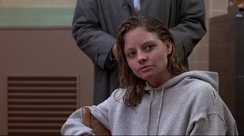 Movie still from “The Accused” (1988), directed by Jonathan Kaplan – A woman with wet hair sitting next to a man in a suit; Close Up shot, Low angle