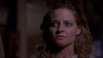 Movie still from “The Accused” (1988), directed by Jonathan Kaplan – A person with long blonde hair; Close Up shot, Low angle