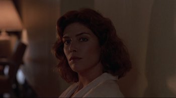 Movie still from “The Accused” (1988), directed by Jonathan Kaplan – A person wearing a white shirt; Close Up shot, Low angle