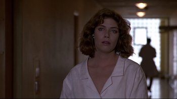 Movie still from “The Accused” (1988), directed by Jonathan Kaplan – A person wearing a white shirt; Close Up shot, Low angle