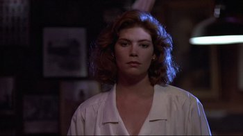 Movie still from “The Accused” (1988), directed by Jonathan Kaplan – A person wearing a white shirt; Close Up shot, Low angle