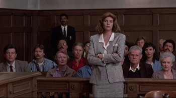 Movie still from “The Accused” (1988), directed by Jonathan Kaplan – A group of people sitting in a court room; Medium shot, Low angle