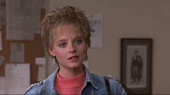 Movie still from “The Accused” (1988), directed by Jonathan Kaplan – A person with short hair; Close Up shot, Over the shoulder angle