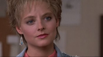 Movie still from “The Accused” (1988), directed by Jonathan Kaplan – A person with short hair; Close Up shot, Over the shoulder angle