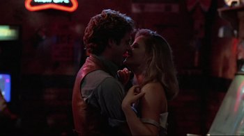 Movie still from “The Accused” (1988), directed by Jonathan Kaplan – A man and a woman are kissing in a bar; Close Up shot, Low angle