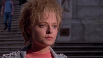 Movie still from “The Accused” (1988), directed by Jonathan Kaplan – A person wearing a pink shirt; Close Up shot, Low angle