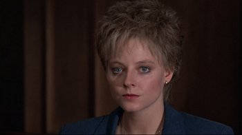 Movie still from “The Accused” (1988), directed by Jonathan Kaplan – A person with short hair; Close Up shot, Over the shoulder angle