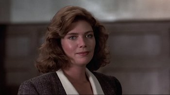 Movie still from “The Accused” (1988), directed by Jonathan Kaplan – A person with curly hair; Close Up shot, Low angle