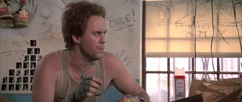 Movie still from “The Adventures of Buckaroo Banzai Across the 8th Dimension” (1984), directed by W.D. Richter – A man with a cigarette in his mouth; Close Up shot, Low angle