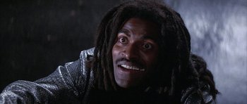 Movie still from “The Adventures of Buckaroo Banzai Across the 8th Dimension” (1984), directed by W.D. Richter – A person with dreadlocks; Close Up shot, Low angle