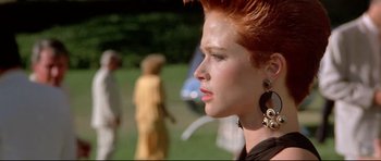 Movie still from “The Adventures of Ford Fairlane” (1990), directed by Renny Harlin – A person with a red head; Close Up shot, Over the shoulder angle