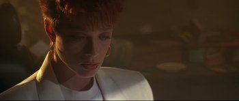 Movie still from “The Adventures of Ford Fairlane” (1990), directed by Renny Harlin – A person wearing a white shirt; Close Up shot, Low angle