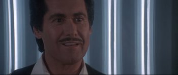 Movie still from “The Adventures of Ford Fairlane” (1990), directed by Renny Harlin – A person with a mustache; Close Up shot, Low angle