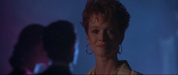 Movie still from “The Adventures of Ford Fairlane” (1990), directed by Renny Harlin – A person wearing a white shirt; Close Up shot, Low angle