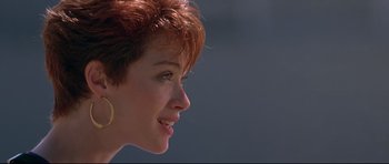 Movie still from “The Adventures of Ford Fairlane” (1990), directed by Renny Harlin – A person with short red hair; Close Up shot, Low angle