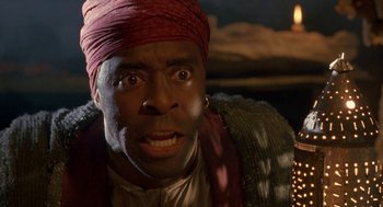 Movie still from “The Adventures of Huck Finn” (1993), directed by Stephen Sommers – A man with a red turban on his head; Close Up shot, Low angle