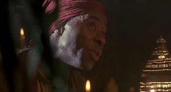 Movie still from “The Adventures of Huck Finn” (1993), directed by Stephen Sommers – A person wearing a red turban; Close Up shot, Low angle