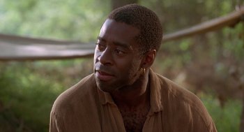 Movie still from “The Adventures of Huck Finn” (1993), directed by Stephen Sommers – A person wearing a brown shirt; Close Up shot, Over the shoulder angle