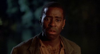 Movie still from “The Adventures of Huck Finn” (1993), directed by Stephen Sommers – A person wearing a jacket; Close Up shot, Low angle