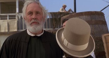 Movie still from “The Adventures of Huck Finn” (1993), directed by Stephen Sommers – A man with a long white beard wearing a hat; Close Up shot, Low angle