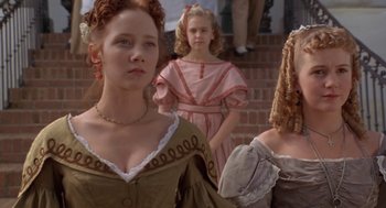 Movie still from “The Adventures of Huck Finn” (1993), directed by Stephen Sommers – A group of young women standing next to each other on steps; Close Up shot, Low angle