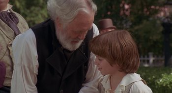 Movie still from “The Adventures of Huck Finn” (1993), directed by Stephen Sommers – An older man and a young boy looking at each other; Close Up shot, Over the shoulder angle
