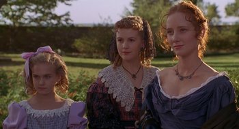 Movie still from “The Adventures of Huck Finn” (1993), directed by Stephen Sommers – A group of women standing next to each other in a field; Close Up shot, Low angle