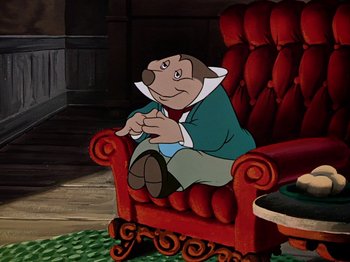 Movie still from “The Adventures of Ichabod and Mr. Toad” (1949), directed by Jack Kinney – A man sitting in a red chair in a living room; Medium shot, High angle