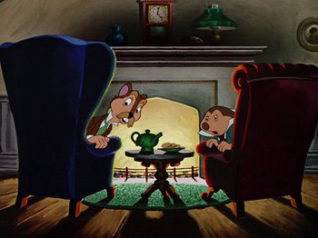 Movie still from “The Adventures of Ichabod and Mr. Toad” (1949), directed by Jack Kinney – Two people sitting at a table in a room; Wide shot, High angle