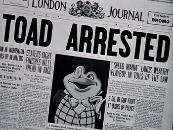 Movie still from “The Adventures of Ichabod and Mr. Toad” (1949), directed by Jack Kinney – An old newspaper with an image of a man in a frog costume; Extreme Close Up shot, High angle