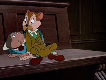 Movie still from “The Adventures of Ichabod and Mr. Toad” (1949), directed by Jack Kinney – A couple of people sitting on top of a wooden bench; Medium shot, High angle