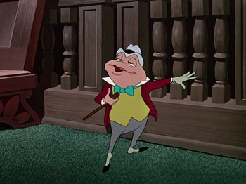 Movie still from “The Adventures of Ichabod and Mr. Toad” (1949), directed by Jack Kinney – A cartoon of a man with a cane in his mouth; Medium shot, Low angle