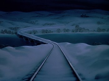 Movie still from “The Adventures of Ichabod and Mr. Toad” (1949), directed by Jack Kinney – A train track going over a bridge in the snow at night time; Extreme Wide shot, High angle