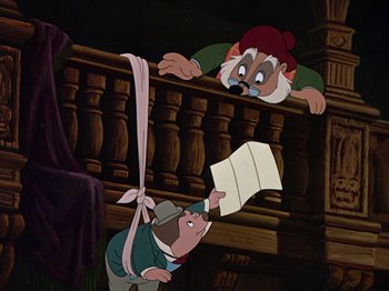 Movie still from “The Adventures of Ichabod and Mr. Toad” (1949), directed by Jack Kinney – An animated scene of a man holding a paper while another man watches; Medium shot, Overhead angle