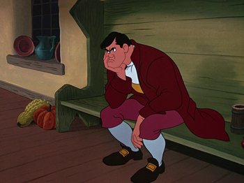 Movie still from “The Adventures of Ichabod and Mr. Toad” (1949), directed by Jack Kinney – A man sitting on top of a wooden bench in front of a window; Medium shot, High angle