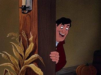 Movie still from “The Adventures of Ichabod and Mr. Toad” (1949), directed by Jack Kinney – A cartoon of a man peeking out from behind a wooden wall; Medium shot, High angle