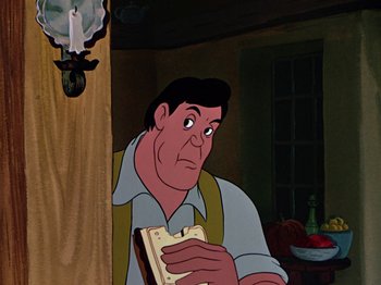 Movie still from “The Adventures of Ichabod and Mr. Toad” (1949), directed by Jack Kinney – A man holding an open book while standing next to a wall; Medium shot, Over the shoulder angle