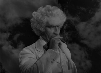 Movie still from “The Adventures of Mark Twain” (1944), directed by Irving Rapper – An old man smoking a cigarette while wearing a suit and tie; Close Up shot, Low angle