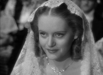 Movie still from “The Adventures of Mark Twain” (1944), directed by Irving Rapper – A black and white photo of a woman wearing a veil; Close Up shot, Over the shoulder angle