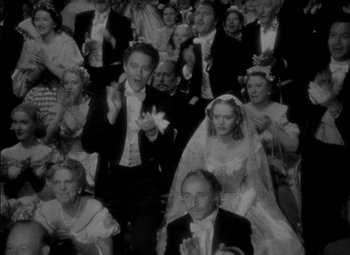 Movie still from “The Adventures of Mark Twain” (1944), directed by Irving Rapper – A black - and - white photo of a crowd of people in formal wear; Wide shot, High angle