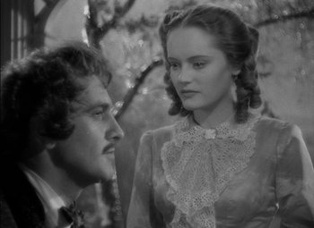 Movie still from “The Adventures of Mark Twain” (1944), directed by Irving Rapper – A man and a woman standing next to each other in front of a tree; Close Up shot, Over the shoulder angle