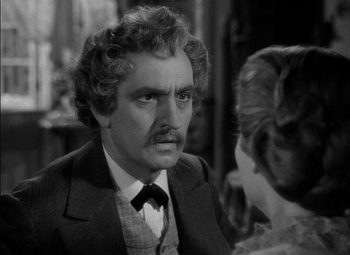 Movie still from “The Adventures of Mark Twain” (1944), directed by Irving Rapper – A black and white photo of a man and a woman; Close Up shot, Over the shoulder angle