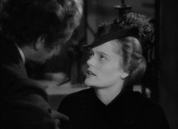 Movie still from “The Adventures of Mark Twain” (1944), directed by Irving Rapper – A woman wearing a hat talking to another woman; Close Up shot, Over the shoulder angle