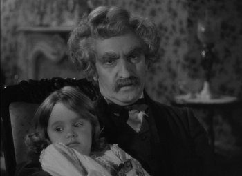 Movie still from “The Adventures of Mark Twain” (1944), directed by Irving Rapper – A man and a little girl are posing for a picture; Close Up shot, High angle