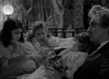 Movie still from “The Adventures of Mark Twain” (1944), directed by Irving Rapper – A group of people sitting on a couch; Medium shot, High angle