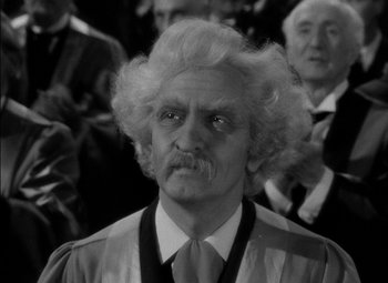 Movie still from “The Adventures of Mark Twain” (1944), directed by Irving Rapper – An old man with a mustache and a wig; Close Up shot, Over the shoulder angle