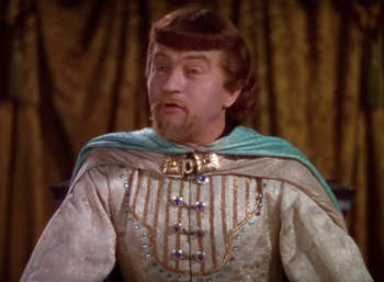 Movie still from “The Adventures of Robin Hood” (1938), directed by William Keighley – A person wearing a costume; Close Up shot, Over the shoulder angle